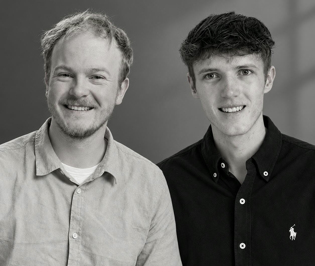 Tobias (left) and Marcus (right), the founders of Marto Studios, smiling in a black-and-white portrait